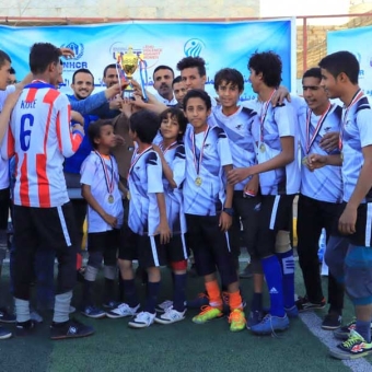Youth sports tournament and community awareness to combat violence against women