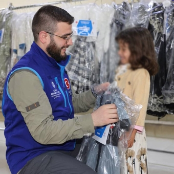 Distribution of 500 food baskets and clothing to 100 children